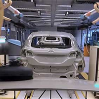 Robots work alongside Ford engineers Robots work alongside Ford engineers