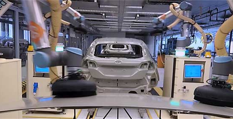 Robots work alongside Ford engineers
